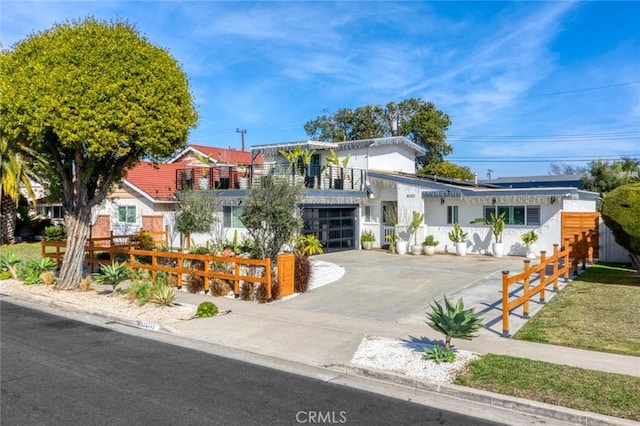 16782 Heritage Ln, Huntington Beach, CA 92647 - view of front facade featuring driveway, an attached garage, and stucco siding