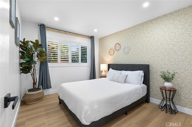 16782 Heritage Ln, Huntington Beach, CA 92647 - bedroom with wallpapered walls, wood finished floors, baseboards, and recessed lighting