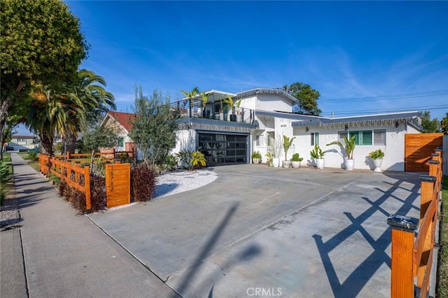 16782 Heritage Ln, Huntington Beach, CA 92647 - view of front of home with driveway, a garage, and stucco siding