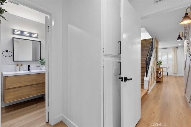 16782 Heritage Ln, Huntington Beach, CA 92647 - hall with light wood-type flooring and baseboards