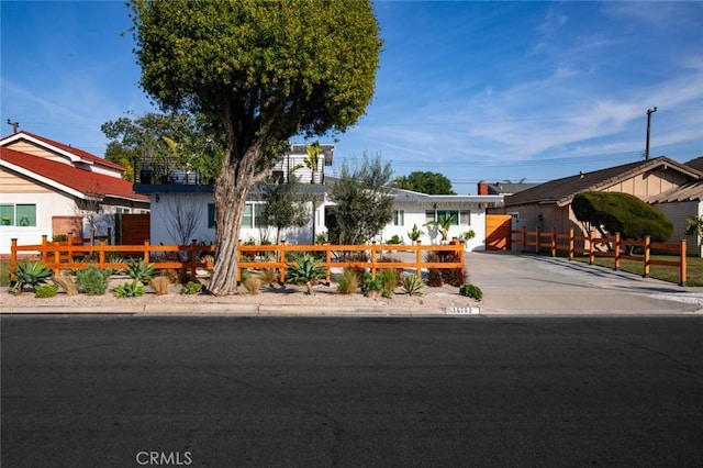 16782 Heritage Ln, Huntington Beach, CA 92647 - single story home with a fenced front yard and concrete driveway
