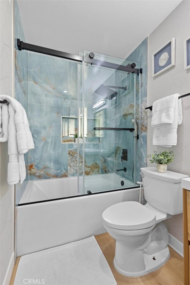 16782 Heritage Ln, Huntington Beach, CA 92647 - full bath featuring wood finished floors, toilet, combined bath / shower with glass door, and vanity