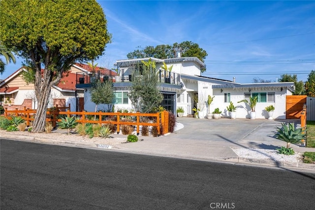 16782 Heritage Ln, Huntington Beach, CA 92647 - view of front of property with a fenced front yard, stucco siding, and a gate