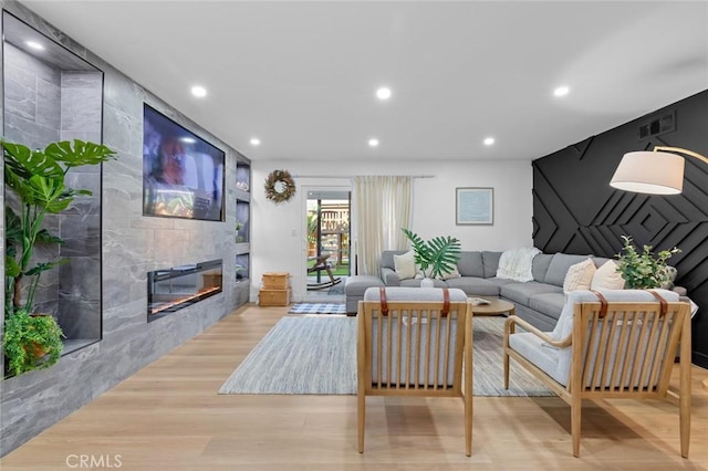 16782 Heritage Ln, Huntington Beach, CA 92647 - living room featuring wood finished floors, a tiled fireplace, and recessed lighting
