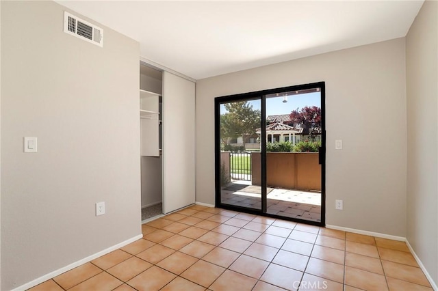 43334 32nd St W Unit 12, Lancaster, CA 93536 - empty room with baseboards and light tile patterned floors