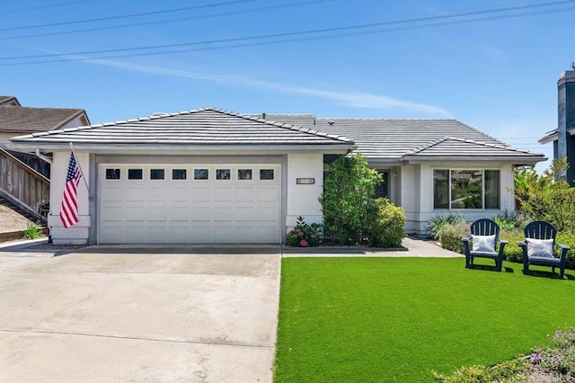 1064 Glen Arbor Dr, Encinitas, CA 92024 - single story home featuring driveway, an attached garage, a front lawn, a tile roof, and stucco siding