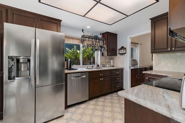 1064 Glen Arbor Dr, Encinitas, CA 92024 - kitchen featuring appliances with stainless steel finishes, a sink, tasteful backsplash, and dark brown cabinetry