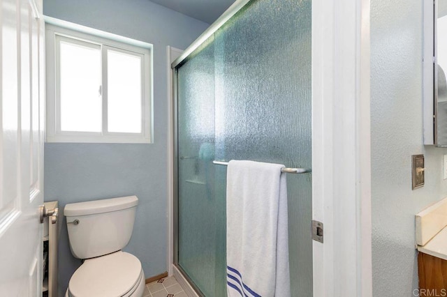 1064 Glen Arbor Dr, Encinitas, CA 92024 - bathroom featuring toilet, a stall shower, vanity, and baseboards