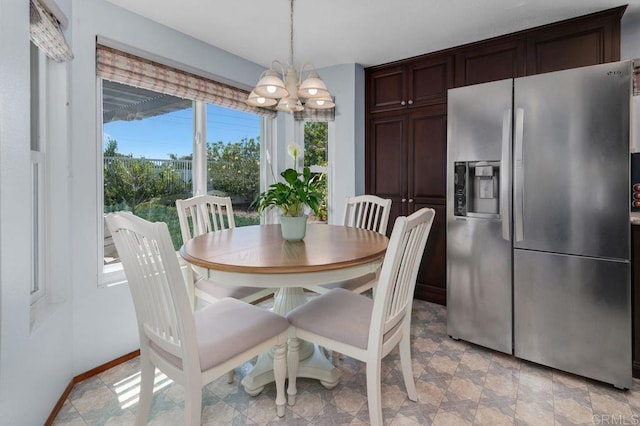 1064 Glen Arbor Dr, Encinitas, CA 92024 - dining space featuring a chandelier, healthy amount of natural light, and baseboards
