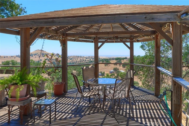 2380 Old Hwy, Catheys Valley, CA 95306 - wooden terrace with outdoor dining space and a mountain view