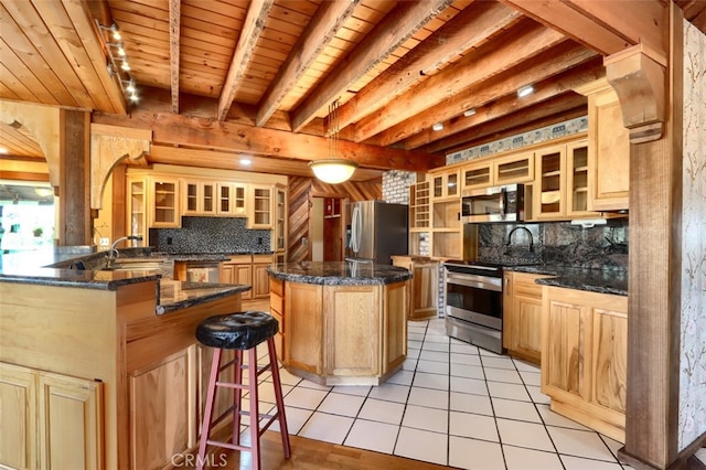 2380 Old Hwy, Catheys Valley, CA 95306 - kitchen featuring stainless steel appliances, decorative backsplash, light tile patterned flooring, a breakfast bar area, and wood ceiling with exposed beams