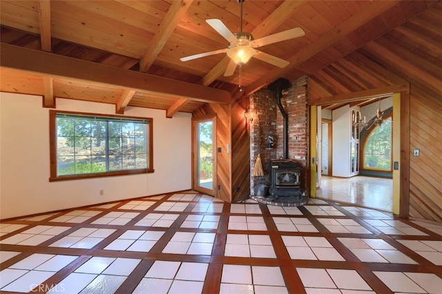 2380 Old Hwy, Catheys Valley, CA 95306 - unfurnished living room featuring inlaid floor details, a wood stove, healthy amount of natural light, wood ceiling, and wood walls