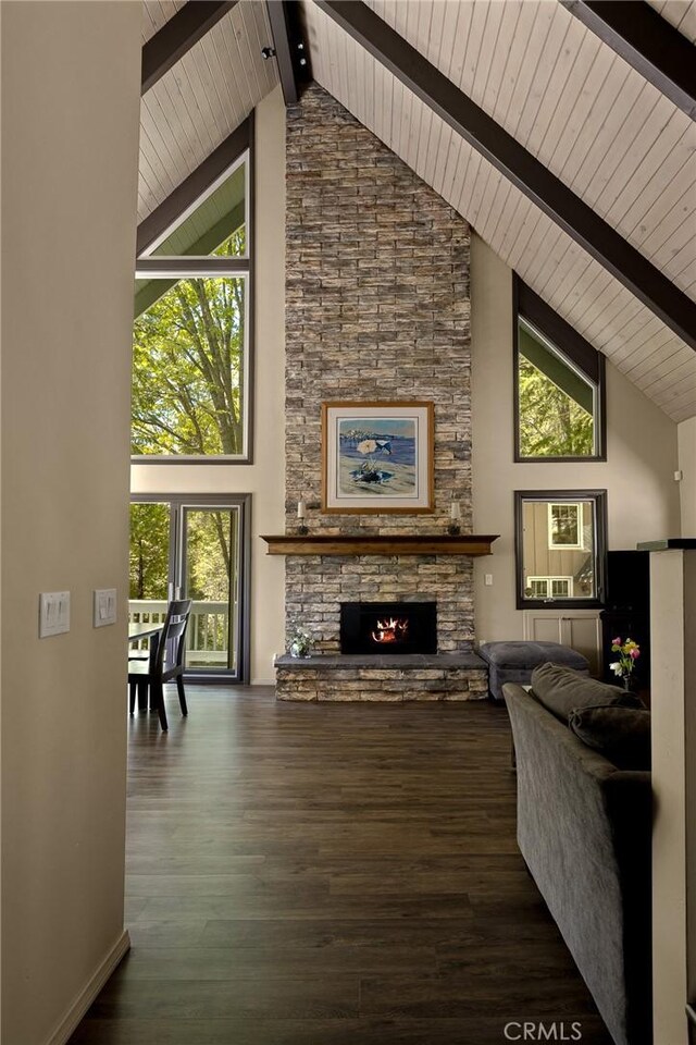 28960 Palisades Dr, Lake Arrowhead, CA 92352 - living area with high vaulted ceiling, a fireplace, wood finished floors, wood ceiling with exposed beams, and healthy amount of natural light