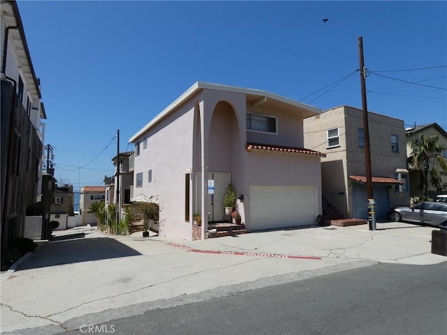 3513 Alma Ave, Manhattan Beach, CA 90266 - view of front of house featuring stucco siding, a garage, and driveway