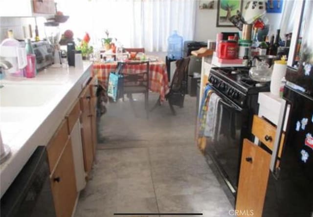 3513 Alma Ave, Manhattan Beach, CA 90266 - kitchen with black appliances, a sink, and light countertops