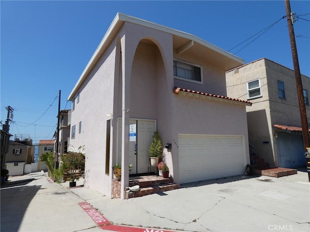 3513 Alma Ave, Manhattan Beach, CA 90266 - view of front of house with stucco siding and a garage
