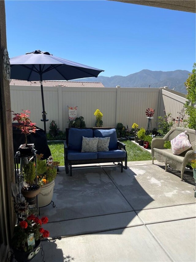 11915 Sagecrest Ct, Corona, CA 92883 - fenced backyard with a mountain view and a patio area