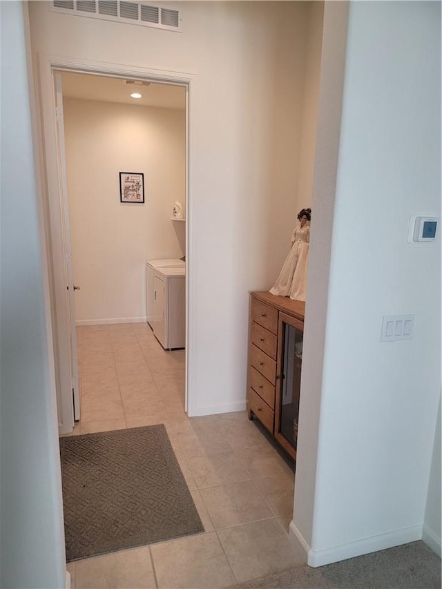 11915 Sagecrest Ct, Corona, CA 92883 - corridor featuring washing machine and clothes dryer, baseboards, and light tile patterned floors
