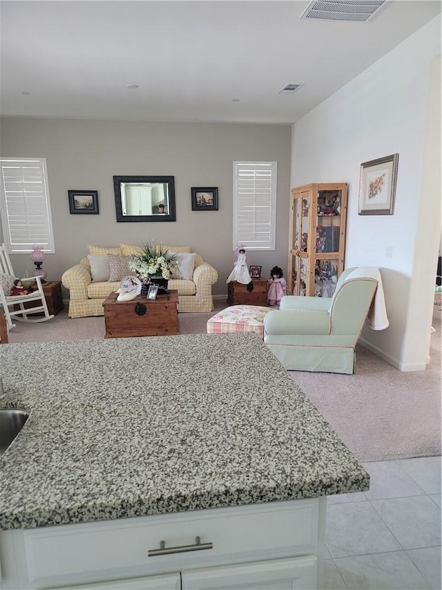 11915 Sagecrest Ct, Corona, CA 92883 - living room with light colored carpet, baseboards, and light tile patterned flooring