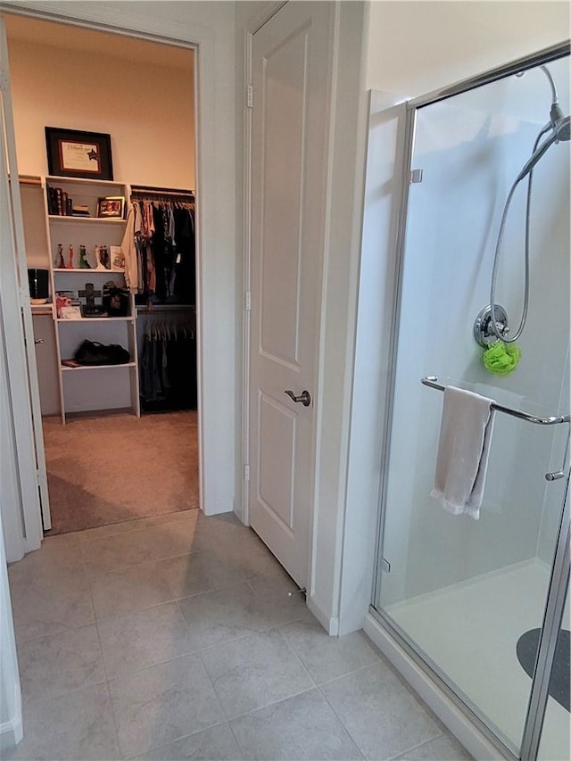 11915 Sagecrest Ct, Corona, CA 92883 - bathroom featuring a stall shower, tile patterned flooring, and a walk in closet