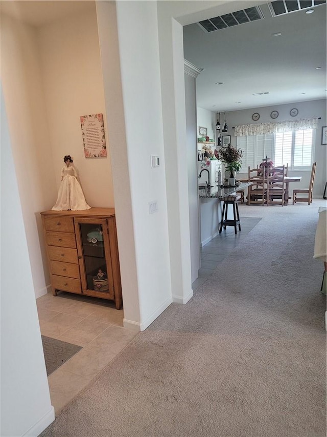 11915 Sagecrest Ct, Corona, CA 92883 - corridor featuring carpet, tile patterned flooring, and baseboards