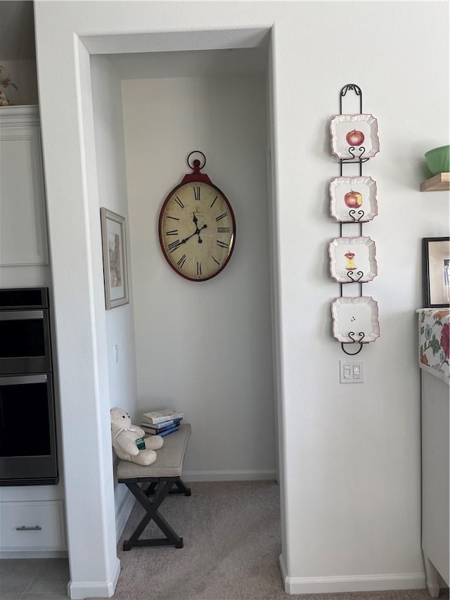 11915 Sagecrest Ct, Corona, CA 92883 - detailed view of baseboards, stainless steel double oven, and carpet flooring