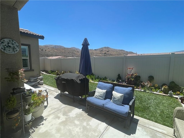 11915 Sagecrest Ct, Corona, CA 92883 - fenced backyard with a mountain view, a patio, and a grill