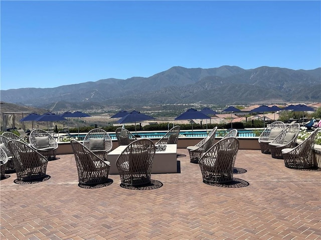 11915 Sagecrest Ct, Corona, CA 92883 - view of patio featuring a mountain view and a community pool