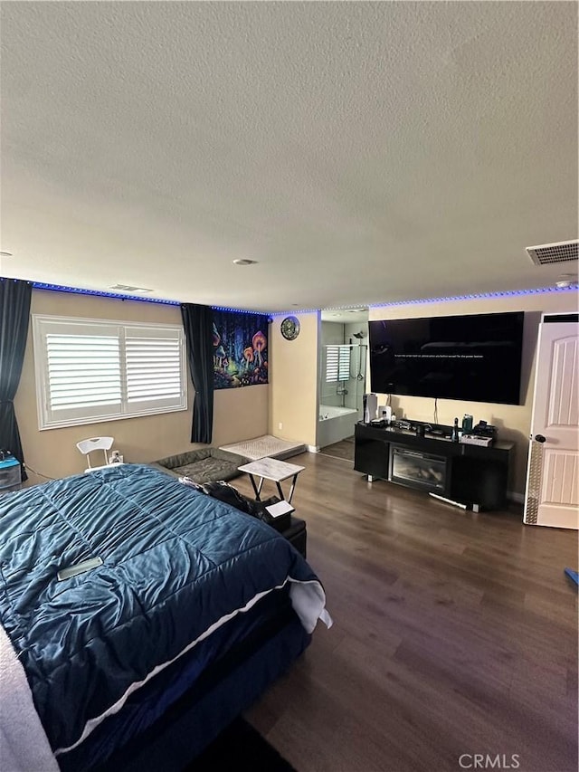 36569 Olea Ct, Beaumont, CA 92223 - bedroom featuring a textured ceiling, wood finished floors, and baseboards