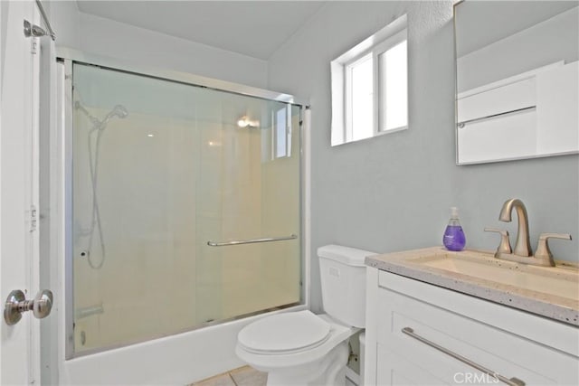 338 W Glencoe St, Compton, CA 90220 - bathroom with vanity, toilet, shower / bath combination with glass door, and tile patterned floors