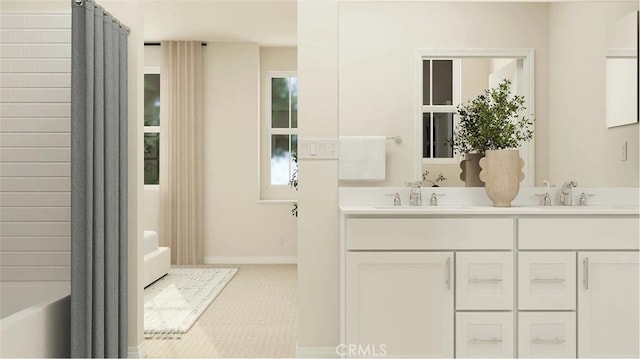 2557 E Hyde Paseo, Ontario, CA 91762 - bathroom with double vanity and baseboards