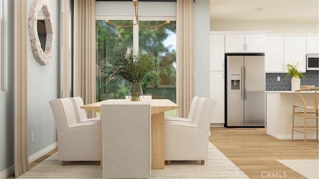 2557 E Hyde Paseo, Ontario, CA 91762 - dining space with light wood-style floors and baseboards