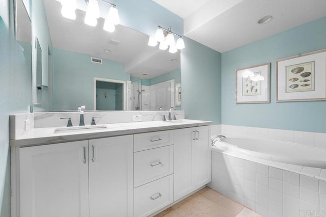 4021 Canario St Unit 235, Carlsbad, CA 92008 - bathroom with double vanity, a shower stall, and a garden tub