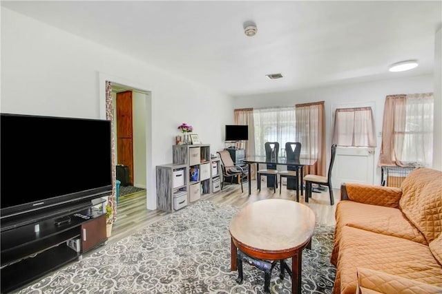 18003 Saticoy St, Reseda, CA 91335 - living room featuring light wood-type flooring