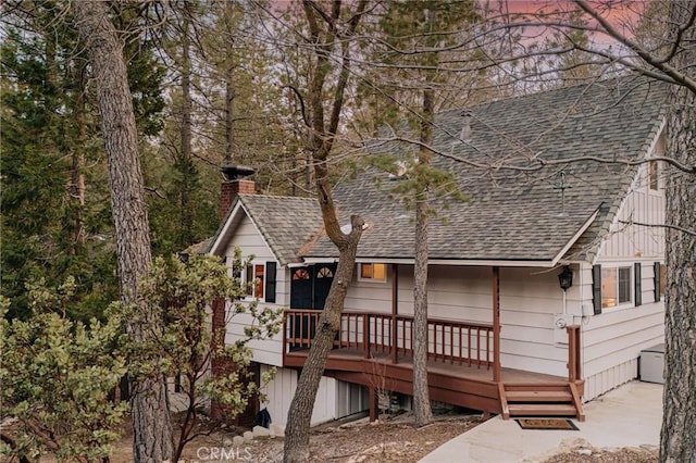 26625 Pinehurst Dr, Lake Arrowhead, CA 92352 - rear view of property featuring roof with shingles, a chimney, and a wooden deck