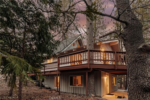 26625 Pinehurst Dr, Lake Arrowhead, CA 92352 - rear view of house with a deck and board and batten siding
