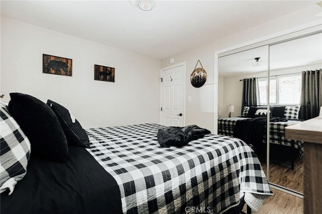 26625 Pinehurst Dr, Lake Arrowhead, CA 92352 - bedroom featuring wood finished floors and a closet
