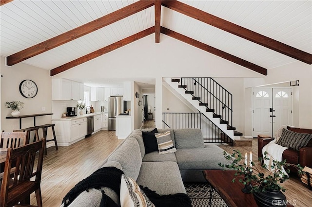 26625 Pinehurst Dr, Lake Arrowhead, CA 92352 - living area with light wood-type flooring, stairs, wooden ceiling with exposed beams, and high vaulted ceiling