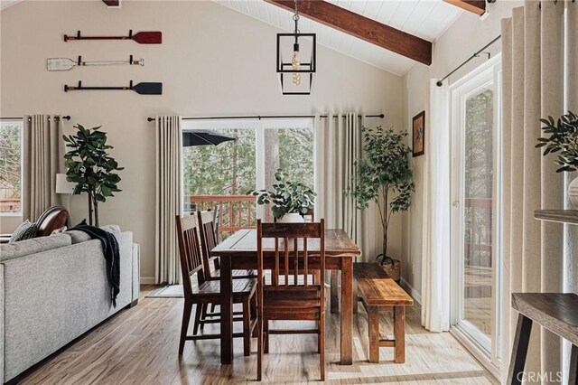 26625 Pinehurst Dr, Lake Arrowhead, CA 92352 - dining room with light wood-style flooring, beam ceiling, healthy amount of natural light, and high vaulted ceiling