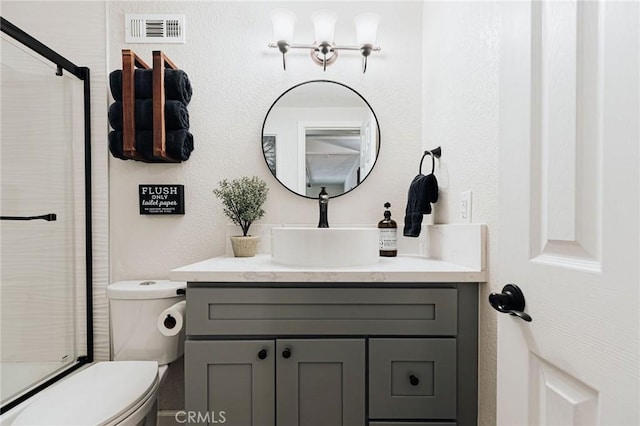 26625 Pinehurst Dr, Lake Arrowhead, CA 92352 - bathroom with vanity, a shower with door, and toilet