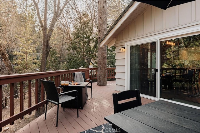 26625 Pinehurst Dr, Lake Arrowhead, CA 92352 - deck with outdoor dining area and a fire pit
