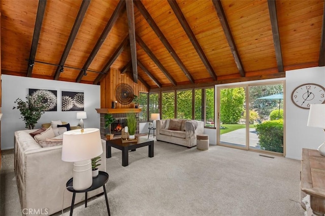 23442 Via Codorniz, Coto De Caza, CA 92679 - living area with wood ceiling with exposed beams, a warm lit fireplace, healthy amount of natural light, carpet flooring, and high vaulted ceiling