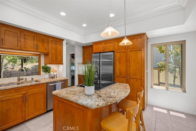 23442 Via Codorniz, Coto De Caza, CA 92679 - kitchen featuring appliances with stainless steel finishes, a sink, brown cabinets, a center island, and crown molding