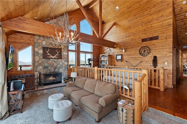 175 N Trails End Rd, Green Valley Lake, CA 92341 - living room with high vaulted ceiling, wooden walls, a chandelier, wood ceiling with exposed beams, and a fireplace