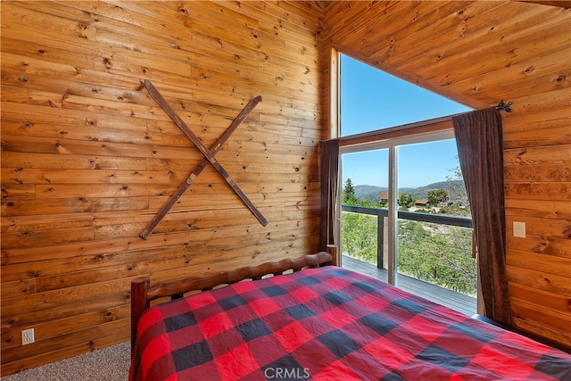 175 N Trails End Rd, Green Valley Lake, CA 92341 - carpeted bedroom with wood walls, a mountain view, and lofted ceiling