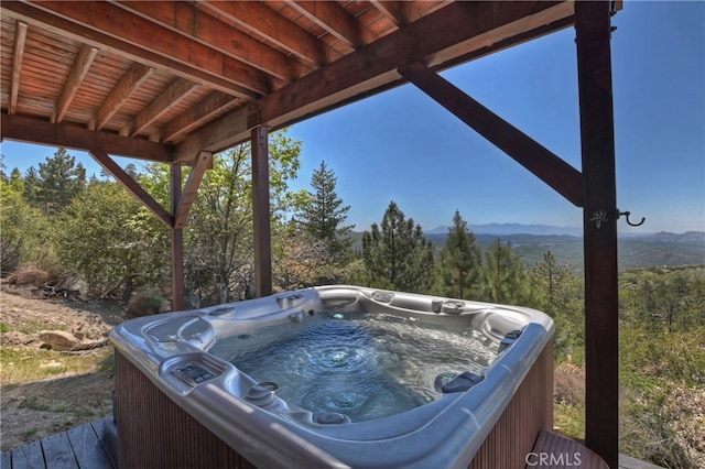 175 N Trails End Rd, Green Valley Lake, CA 92341 - view of patio / terrace with a hot tub and a mountain view