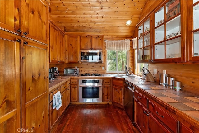 175 N Trails End Rd, Green Valley Lake, CA 92341 - kitchen featuring tile countertops, appliances with stainless steel finishes, a sink, wood ceiling, and dark wood finished floors