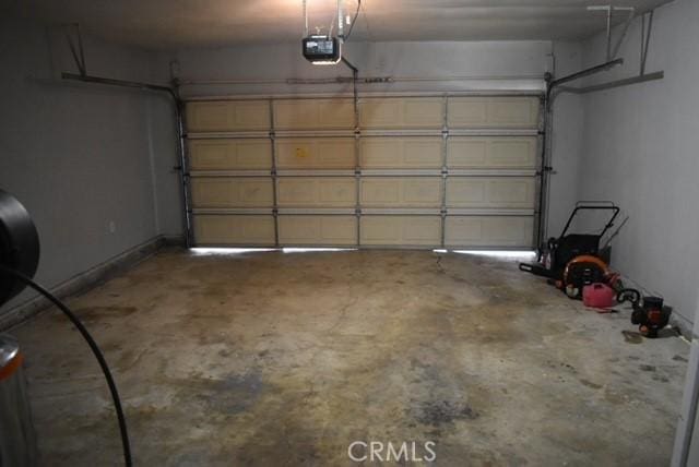 815 California Ave, Dos Palos, CA 93620 - garage with a garage door opener