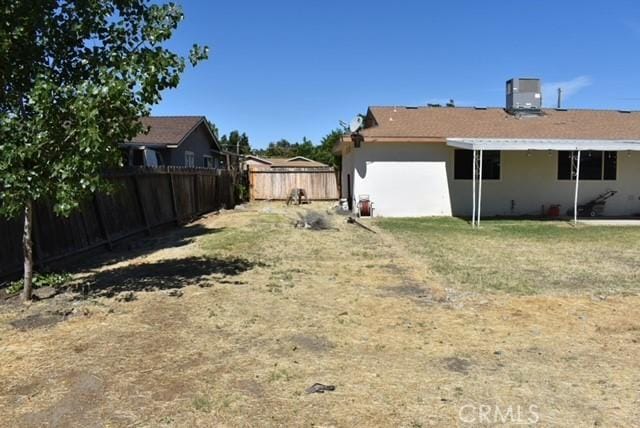815 California Ave, Dos Palos, CA 93620 - fenced backyard with central AC unit