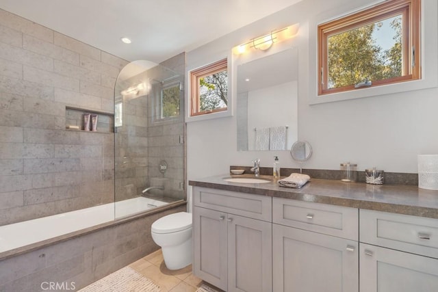 4315 Morro Dr, Woodland Hills, CA 91364 - bathroom featuring toilet, tiled shower / bath combo, vanity, tile patterned floors, and recessed lighting